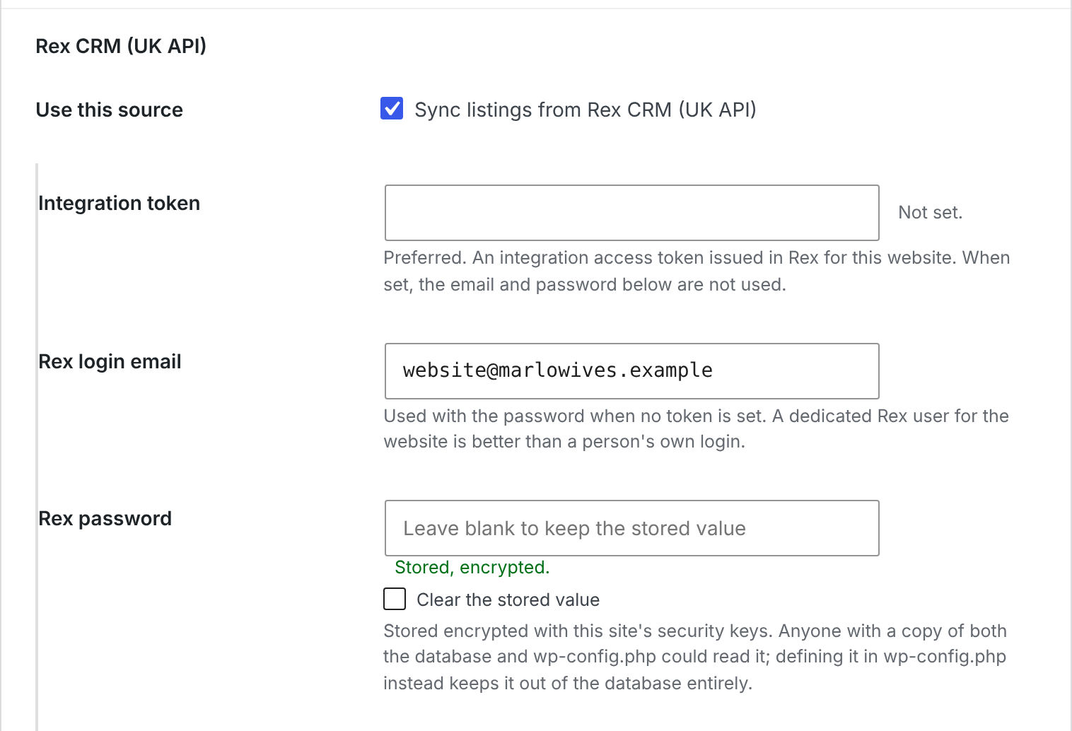 The Realist settings screen showing an encrypted CRM credential stored, with the password never displayed